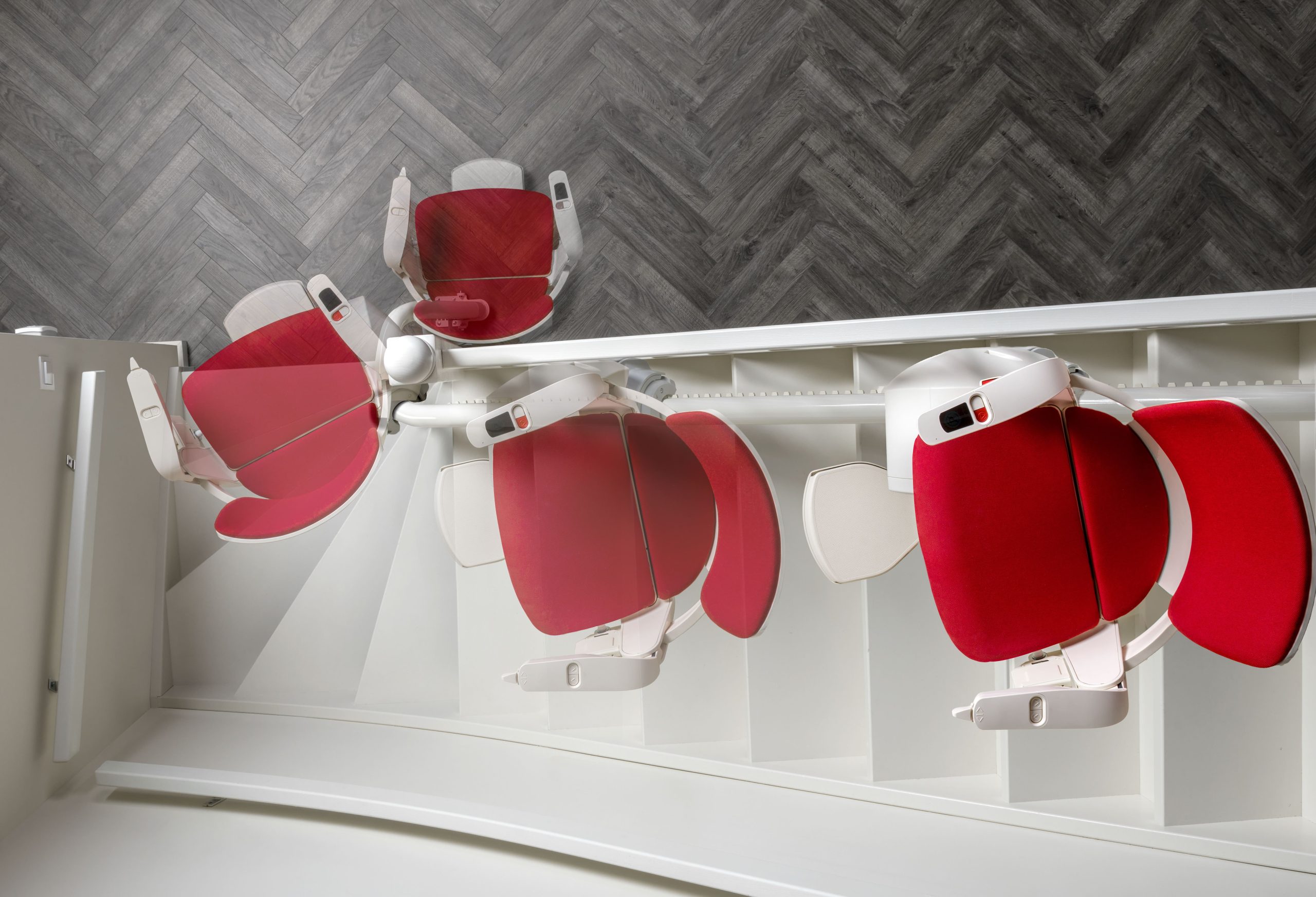 Otolift Modul-Air Smart curved stairlift specialist example moving at angle in motion