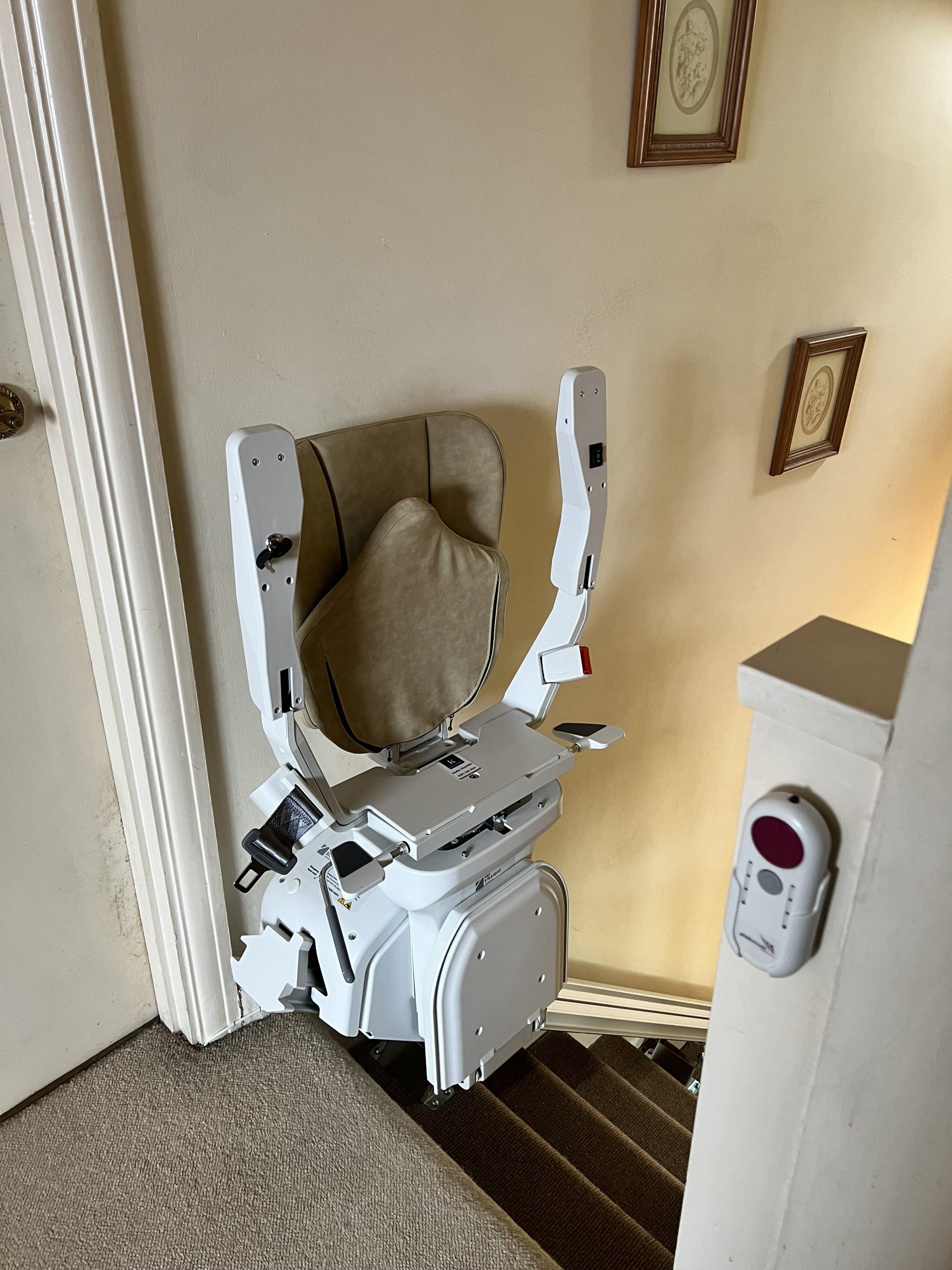 Platinum Ergo Straight straight stairlift specialist example folded and parked at top of staircase