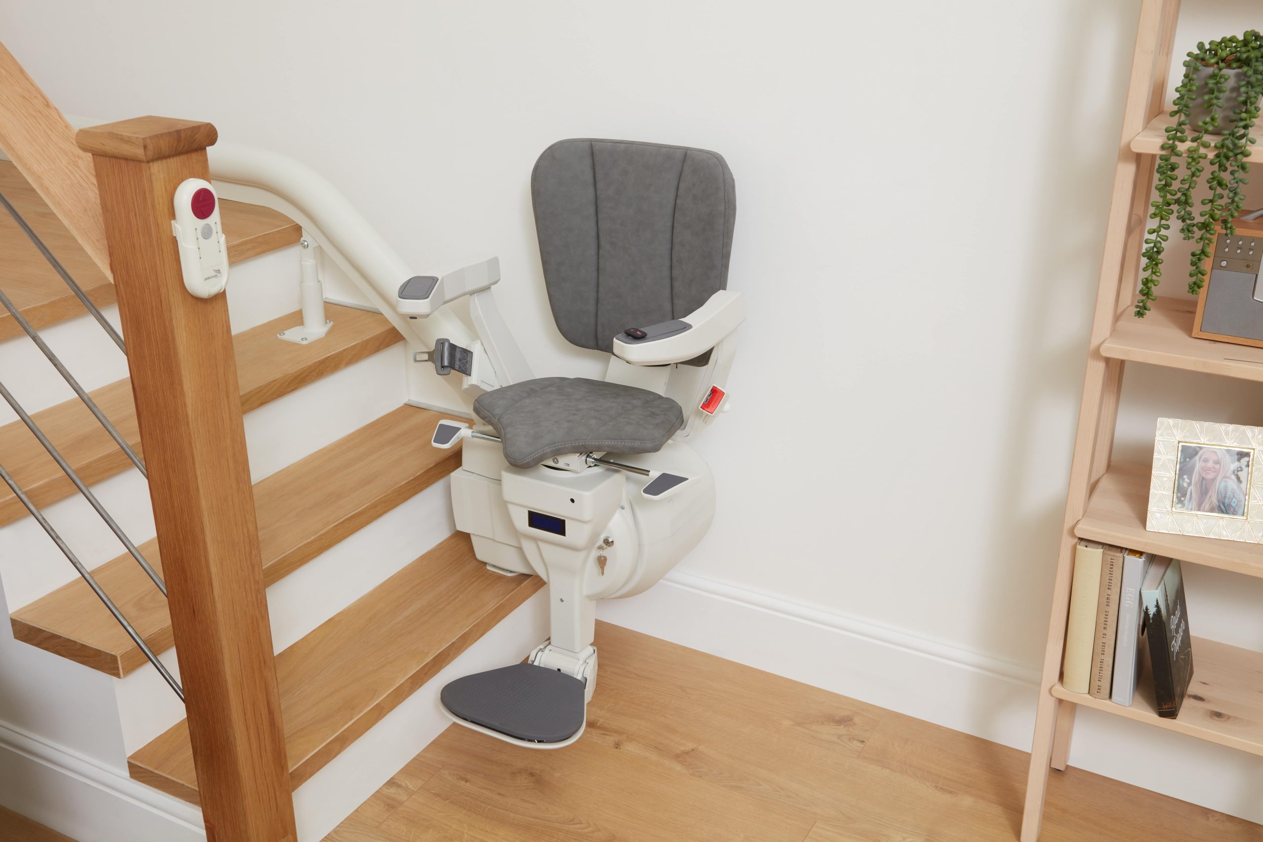 Platinum Ergo Ultimate curved stairlift seat and footrest Ergo Plus seat pad at bottom of stairs